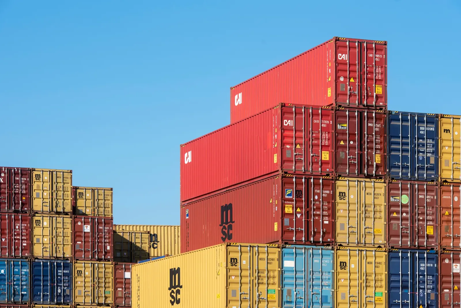 Stacked shipping containers in a cargo yard